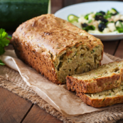Zucchini bread with cheese on a wooden background